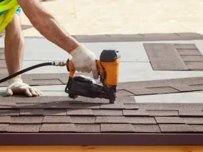 Palm Coast roofing contractor installing shingles