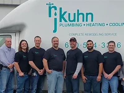 RJ Kuhn team posing in front of company truck