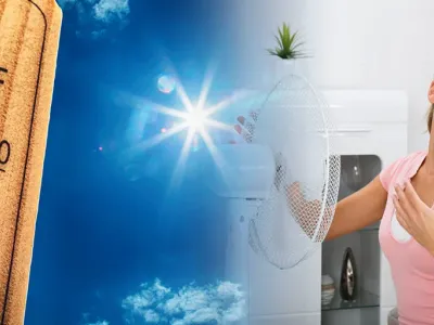 An overheated woman turns on a fan