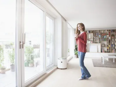 woman-at-home-looking-out-of-window