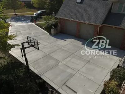 Large concrete driveway with basketball court in Lockport IL by ZBL Concrete & Design